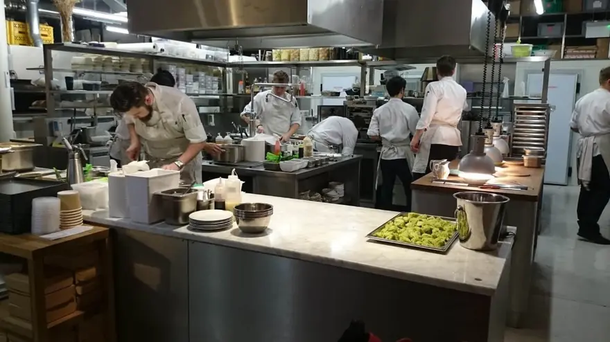 Busy restaurant kitchen during rush hour